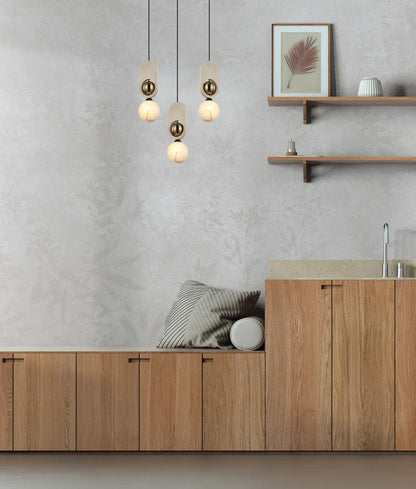PALTA: Interior Sandblasted Opal Diffuser with Brass/Natural Wood Pendant Lights