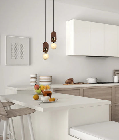 PALTA: Interior Sandblasted Opal Diffuser with Brass/Red Wood Pendant Lights