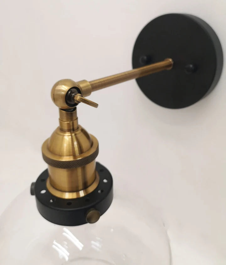 PESINI: Interior Swing Amber Glass with Antique Brass Highlight Wall Light