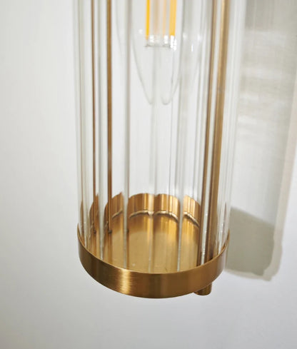 TIEMPO: Interior Up/Down Tubular Clear Glass Wall Light - Antique Brass