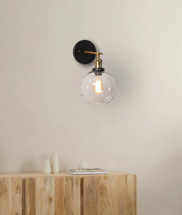 PESINI: Interior Swing Arm Clear Glass with Antique Brass Highlight Wall Light