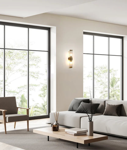 TIEMPO: Interior Up/Down Tubular Clear Glass Wall Light - Antique Brass