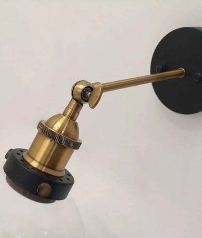 PESINI: Interior Swing Amber Glass with Antique Brass Highlight Wall Light
